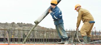 Construction Workers pouring concrete